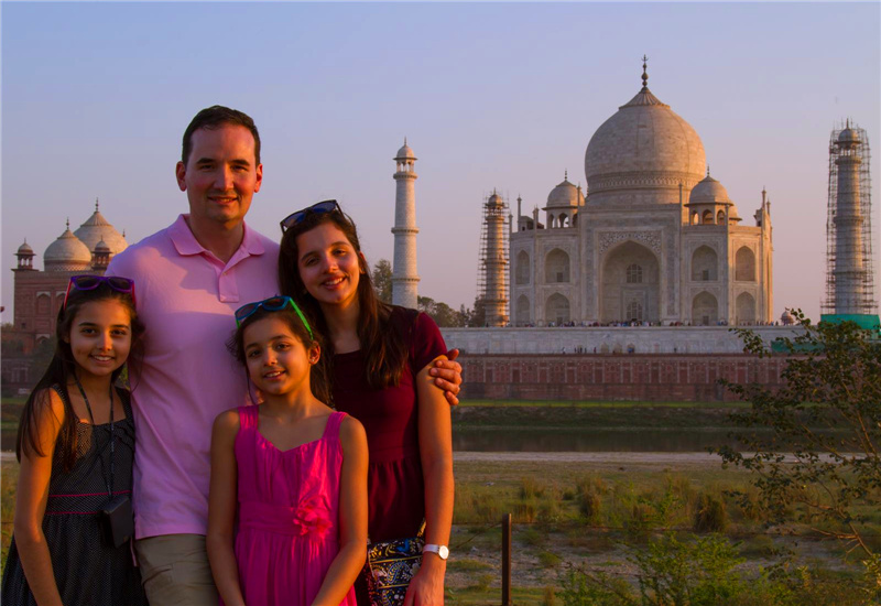 A family photo in front of the Taj Mahal