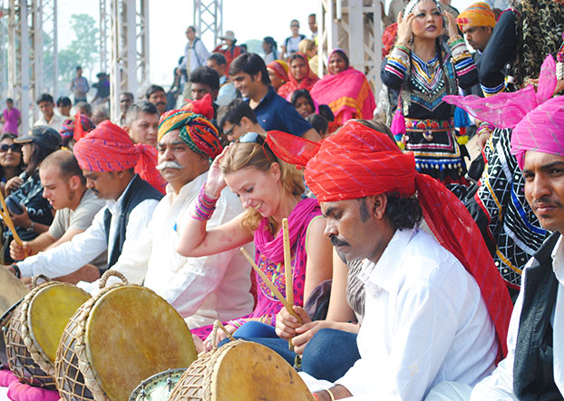 An international tourist in Pushkar Camel Fair in India