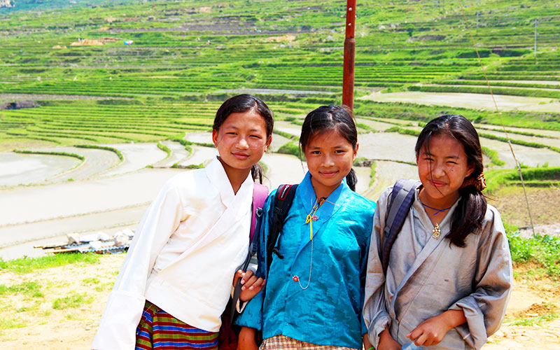 Girls wearing traditional clothes and sweet smiles in Bhutan