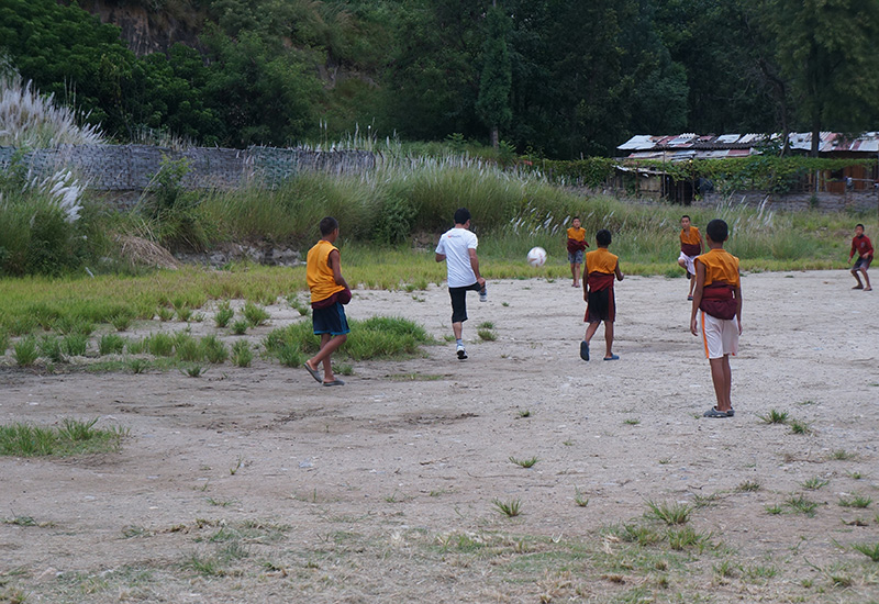 playing football with Bhutanese children