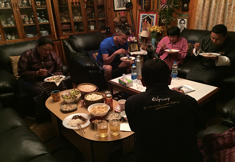 enjoying meal with a rich local family