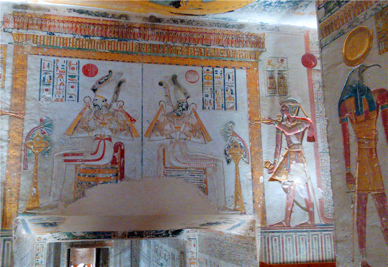 The colorful frescos and hieroglyphs on the wall of one royal tomb in the Valley of the Kings, Luxor