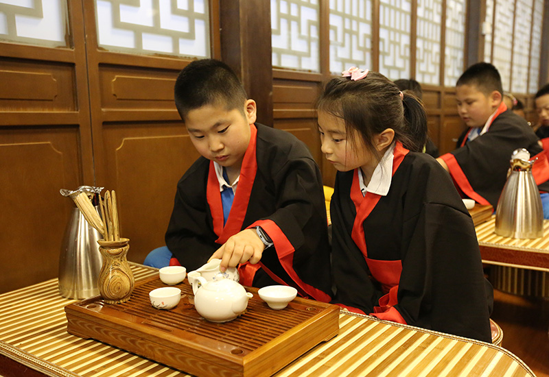 Chinese Kids Making and Serving Tea in Shandong, China