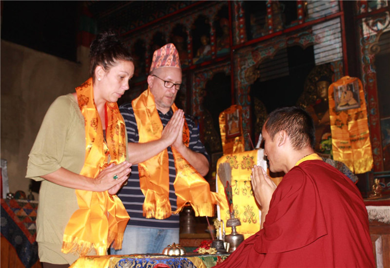 Guests observing Lama's blessing