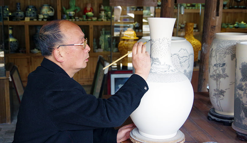 Hand painting an unfinished porcelain