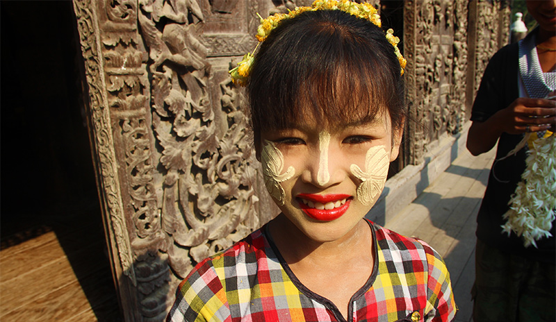 A Myanmar woman with Thanaka on her face