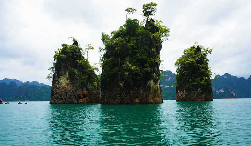 Limestone cliffs jutting out of the pristine water