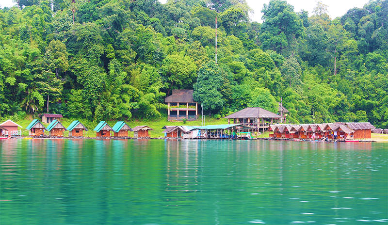 Candy-colored floating bungalows by Cheow Lan Lake