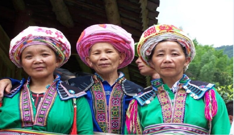 Local minority people dress themselves up during the Double Third Festival