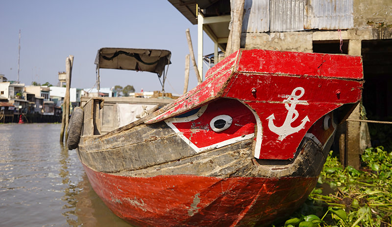 Wooden Boats Painted with Bright Colors and Fish Eyes