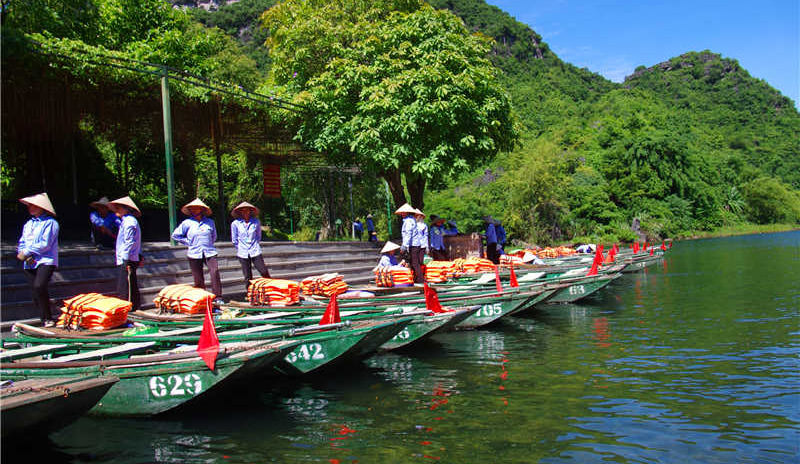 The Boatmen and the Pier in Trang An, Vietnam