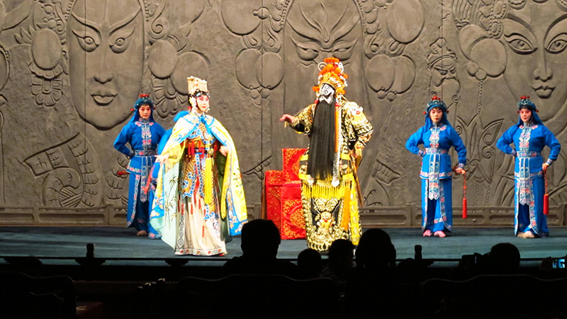 Watch Peking Opera in a theater