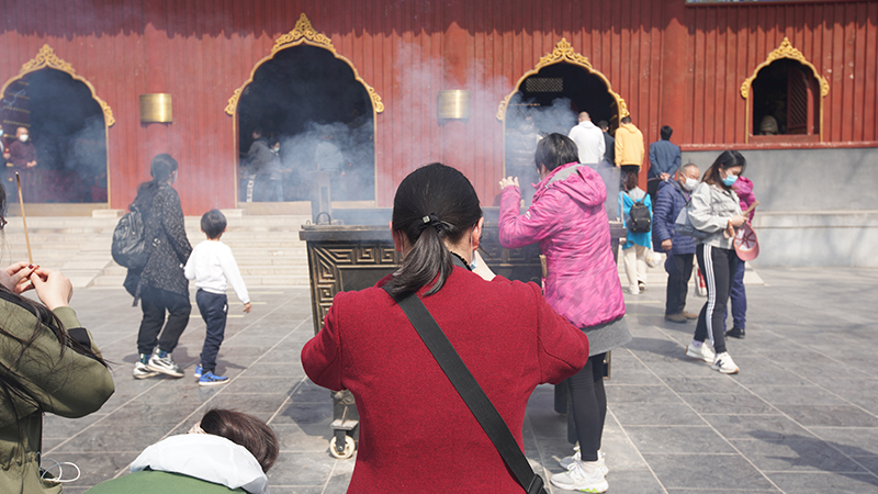 People pray for themselves at Lama Temple