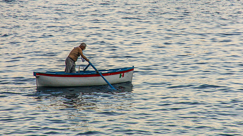 Local People Rowing in the Clear Seawater