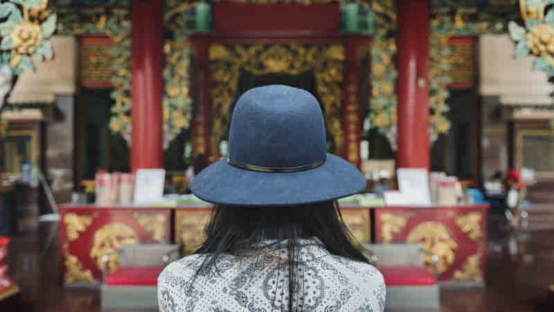 Praying in a Buddhist Temple