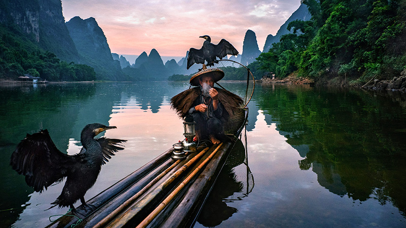 An Old Fisherman Boating on Li River