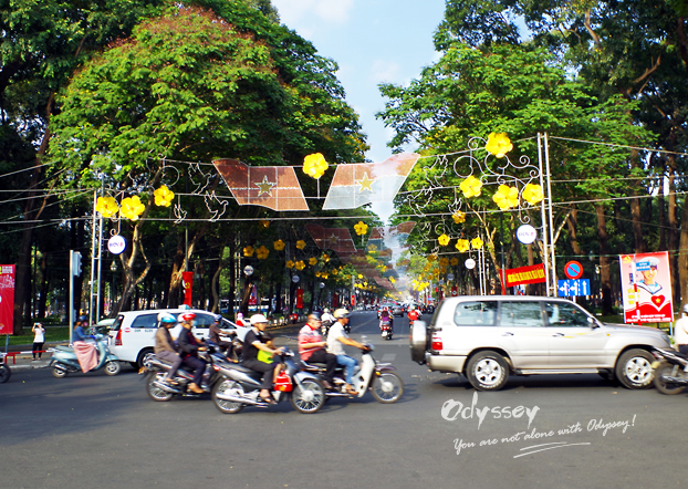 Big replicas of yellow apricot are hung to decorate streets. 