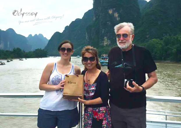 Andrew and Erika, traveled with Odyssey, displaying the snack pack with their guide Fei. 