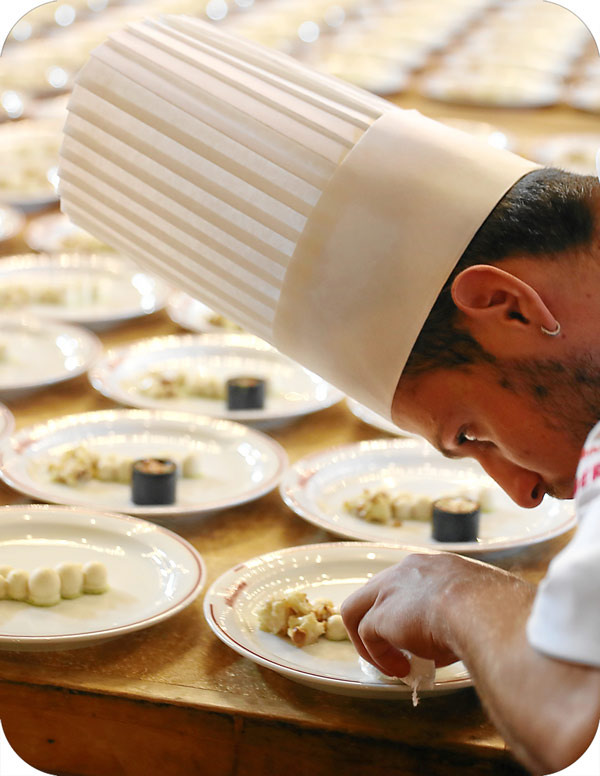 The Italian Chef Setting the Plates