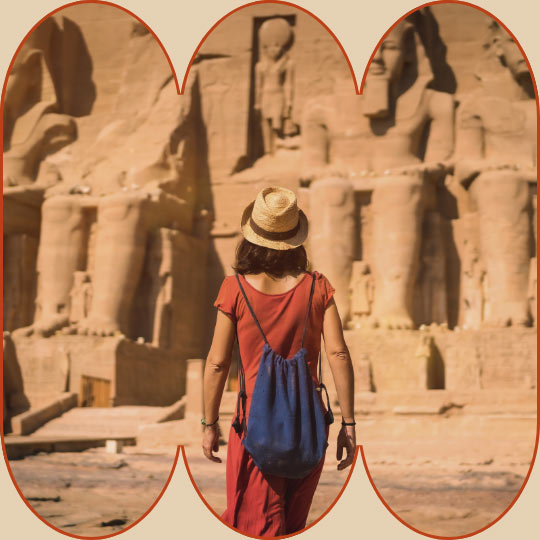Female traveler looking up at Abu Simbel Temple